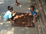 kids playing a game on the street