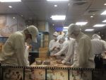 at Din Tai Fung watching workers hand make dumplings